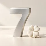 A silver number seven beside an ivory four-leaf clover