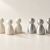 Ivory and silver playing pieces arranged into two groups of three